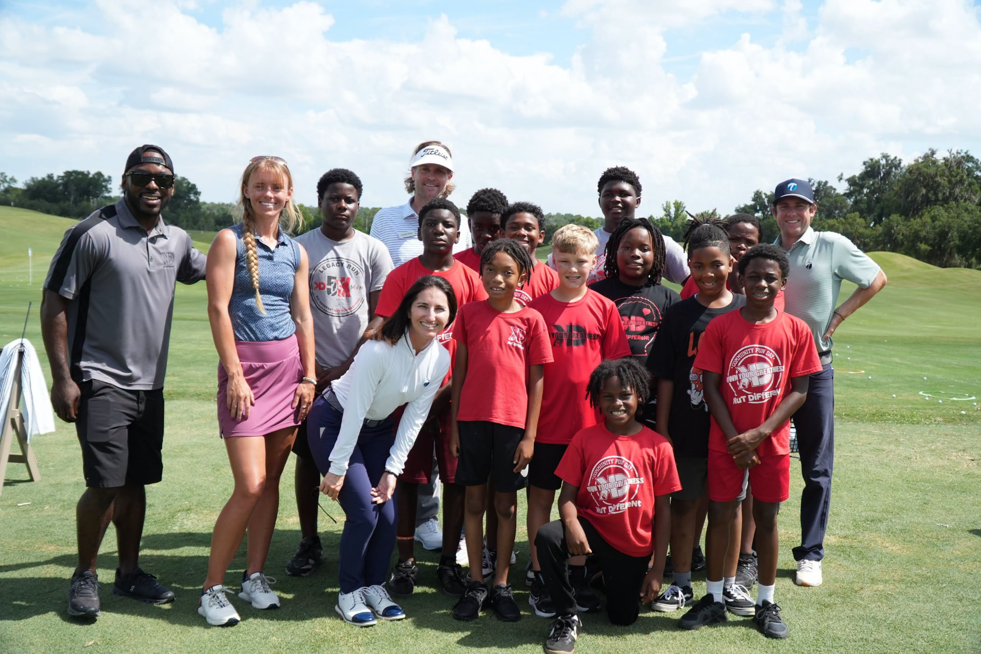 Kut Different mentors and young men together on the golf course in Marion County